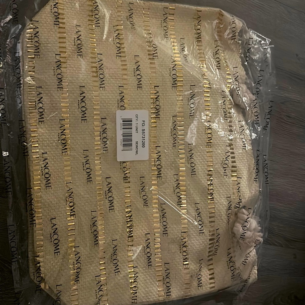 lancôme gold and beige beach bag